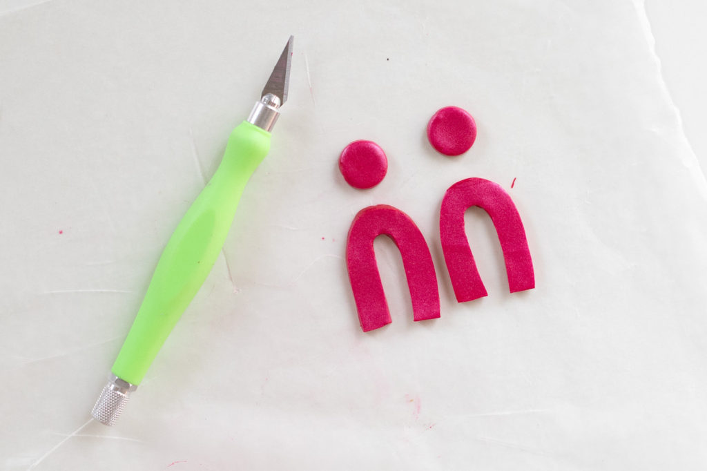 DIY Embossed Earrings with Clay // Make DIY statement earrings with this easy embossing technique for clay using paper embossing sheets! Use your favorite colors and shapes to make unique, lightweight DIY jewelry! #diyjewelry #statementearrings #fashiondiy #accessories #womensfashion #polymerclay #embossed #earrings #jewelry