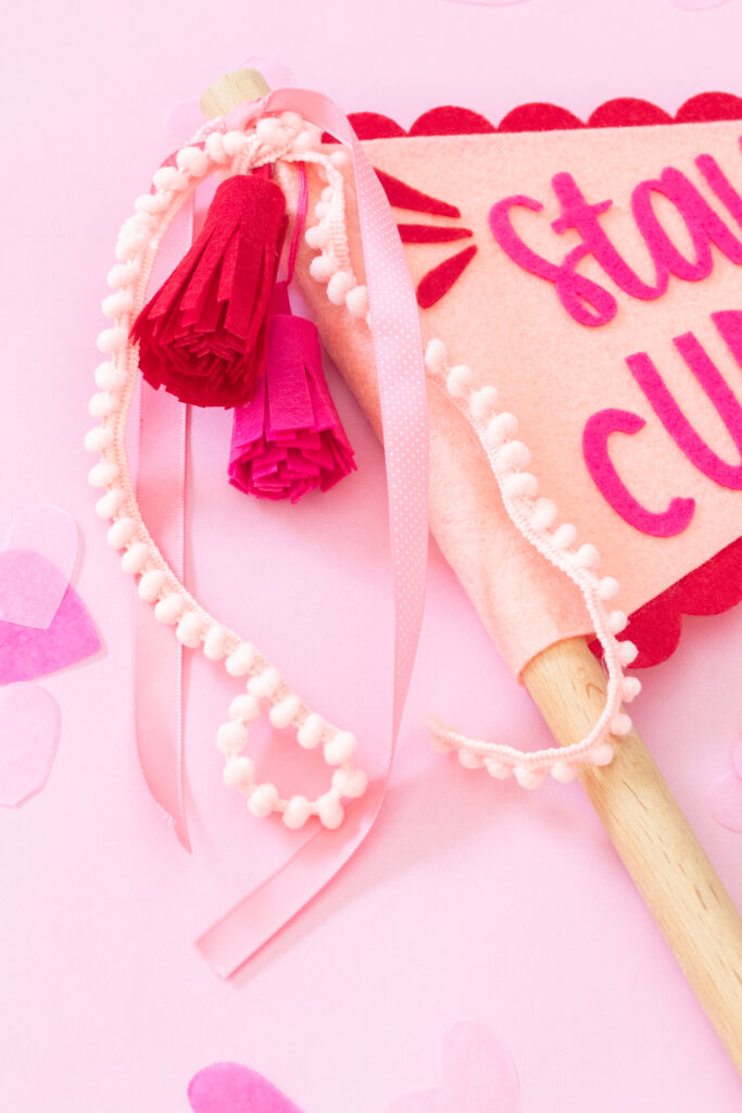 homemade pennant flag with felt made with Cricut on a pink background